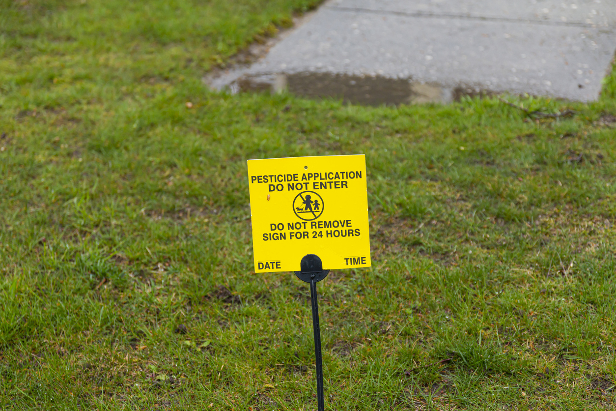 image of a pesticide sign on a lawn