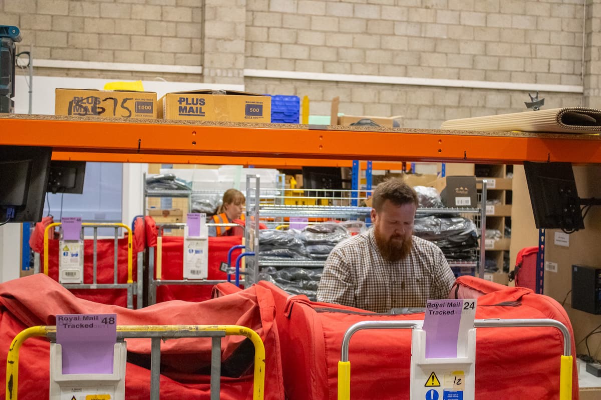 Matt and Sarah packing in the warehouse on a busy day.